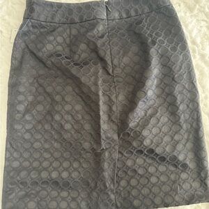 Banana Republic black pencil skirt with a geometric circle design.
